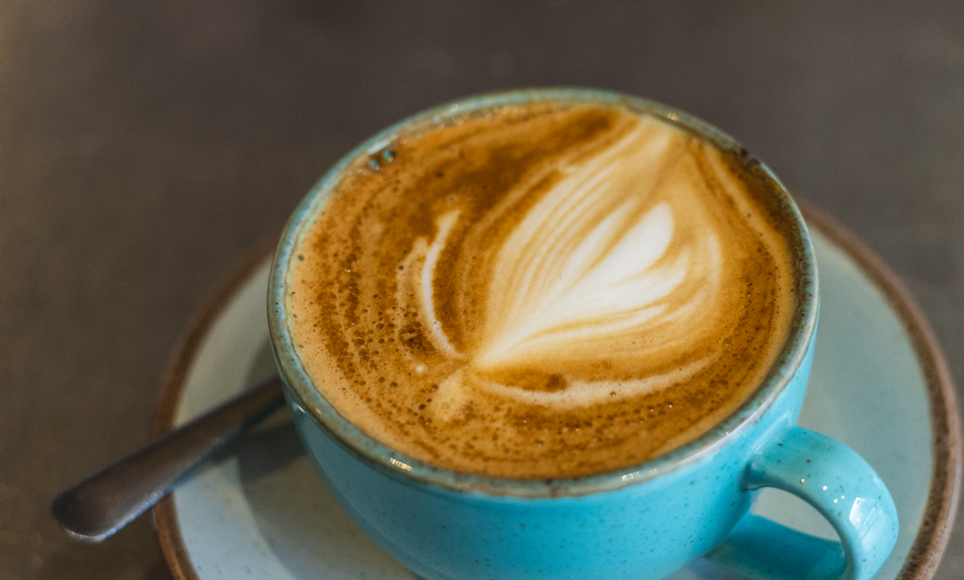 An image of a cappuccino to convey coffee