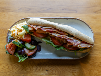 Image of a fresh baguette filled with ham and salad