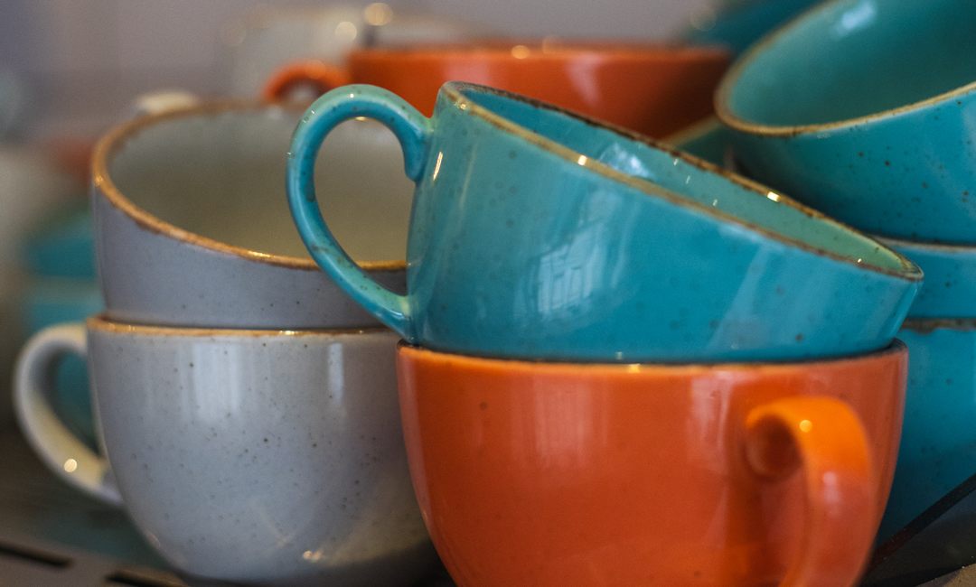 Image of colourful ceramic cups image to convey drinks